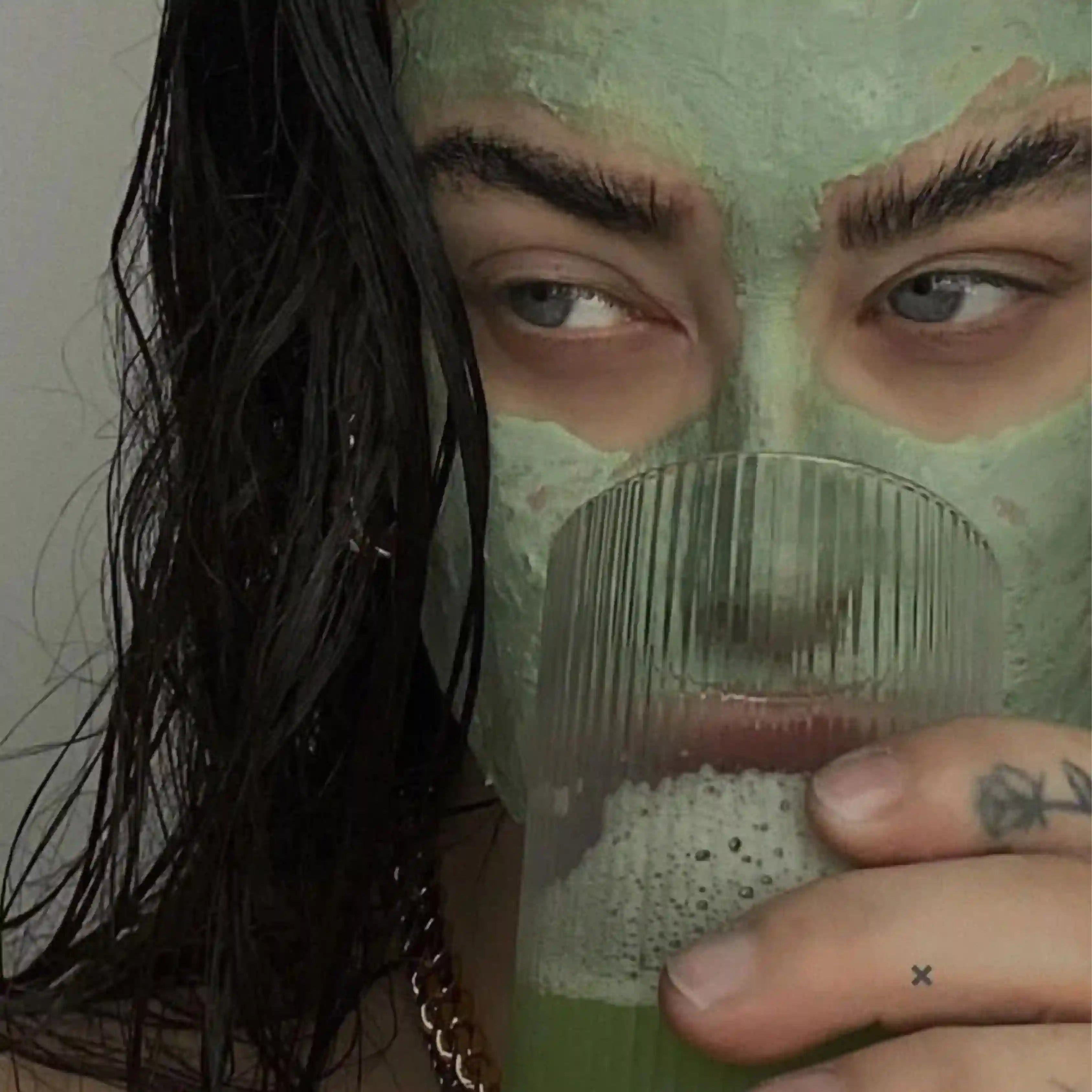 A girl drinking GRNS