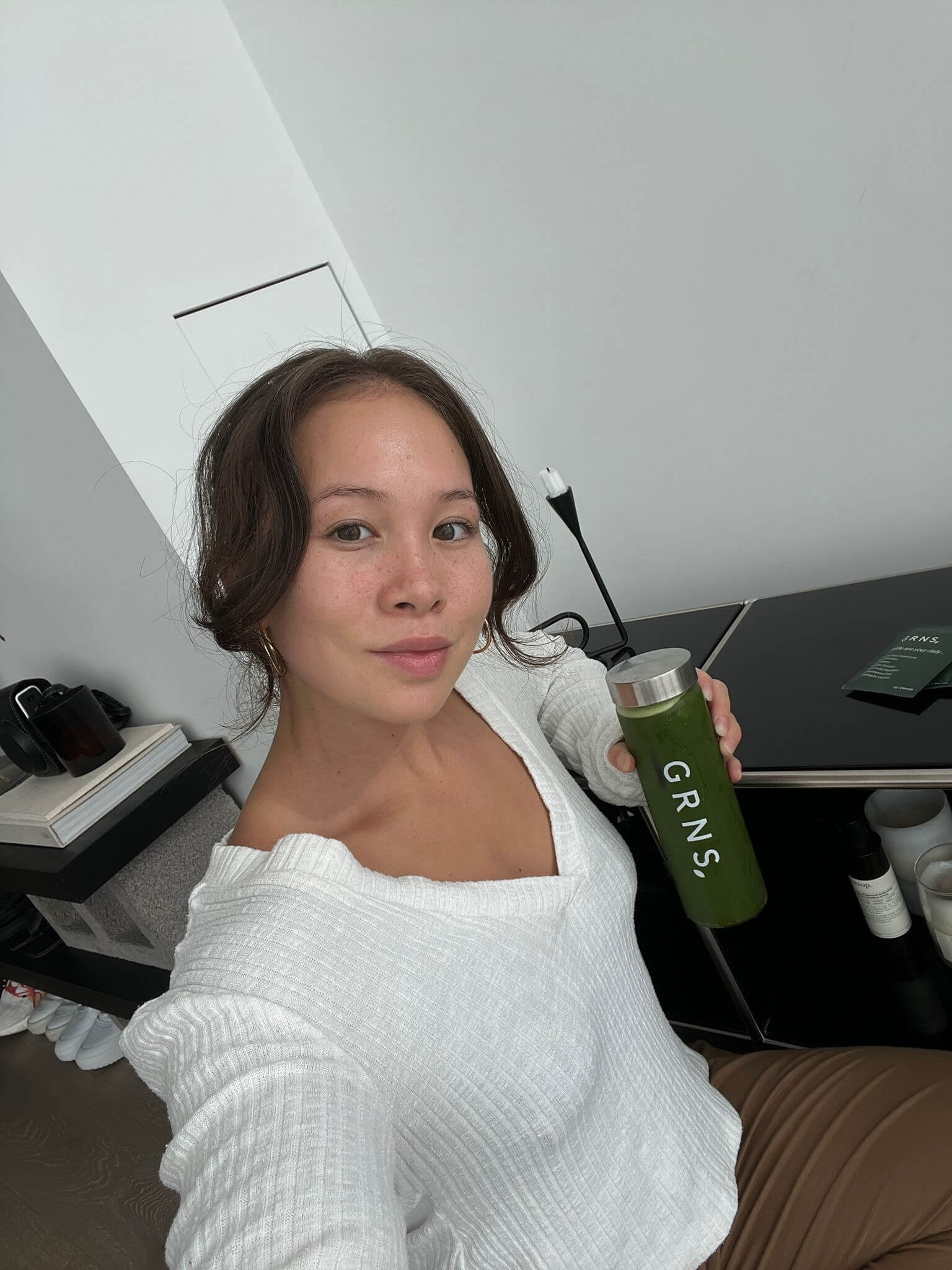 Health Enthusiast, Business Woman Photo of Michaela Taylor holding GRNS