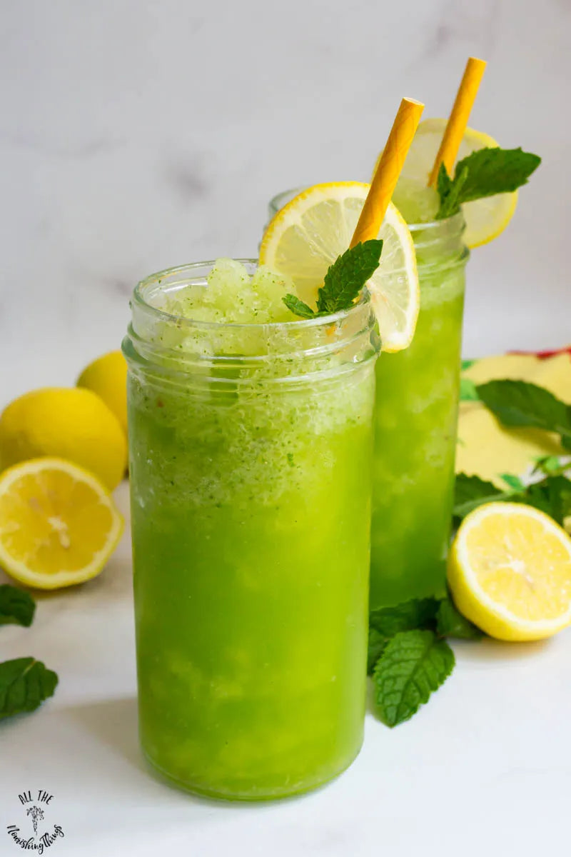 A green slushy with mint, lemon, and ice
