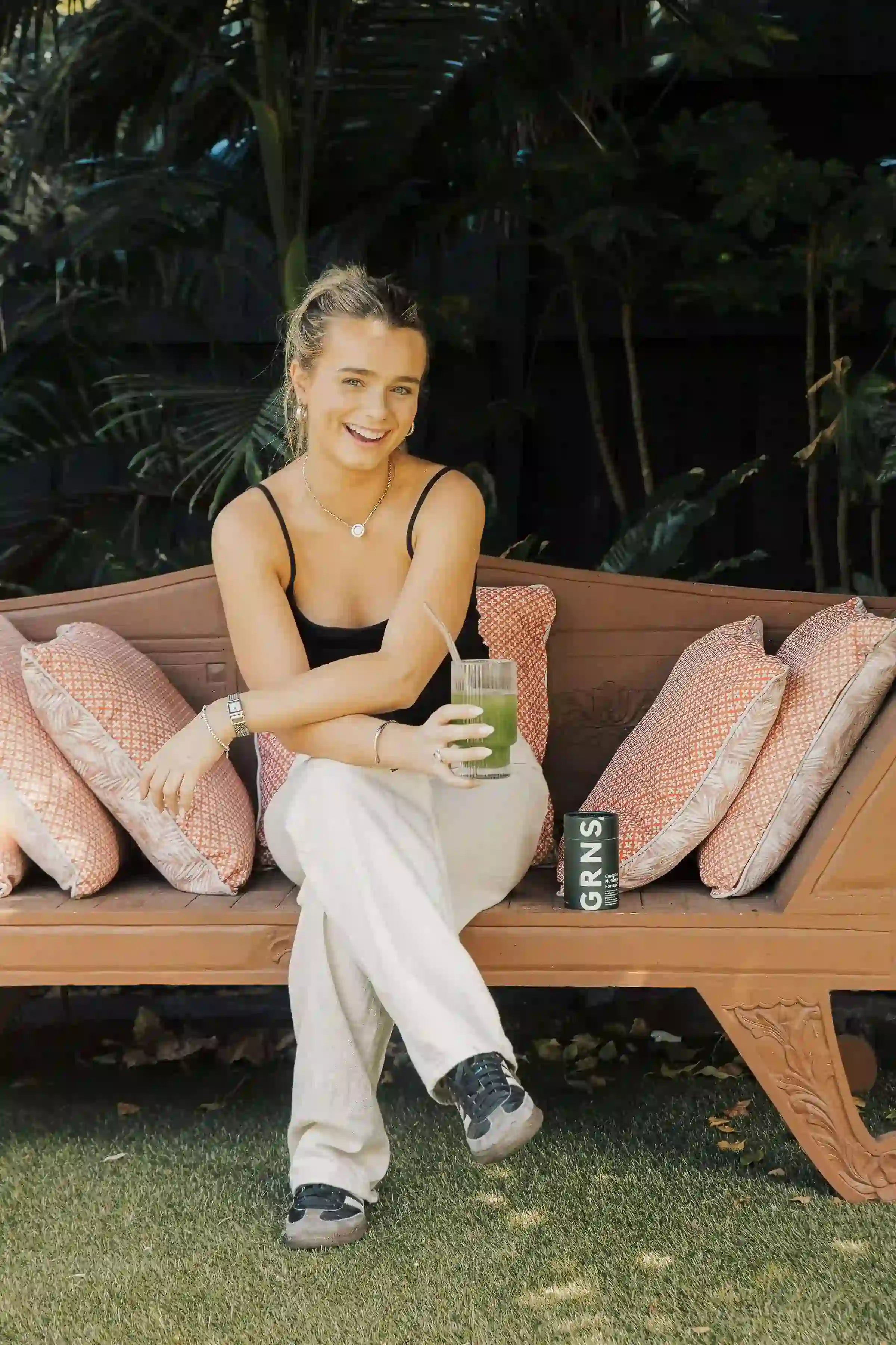 Girl happy and drinking her GRNS