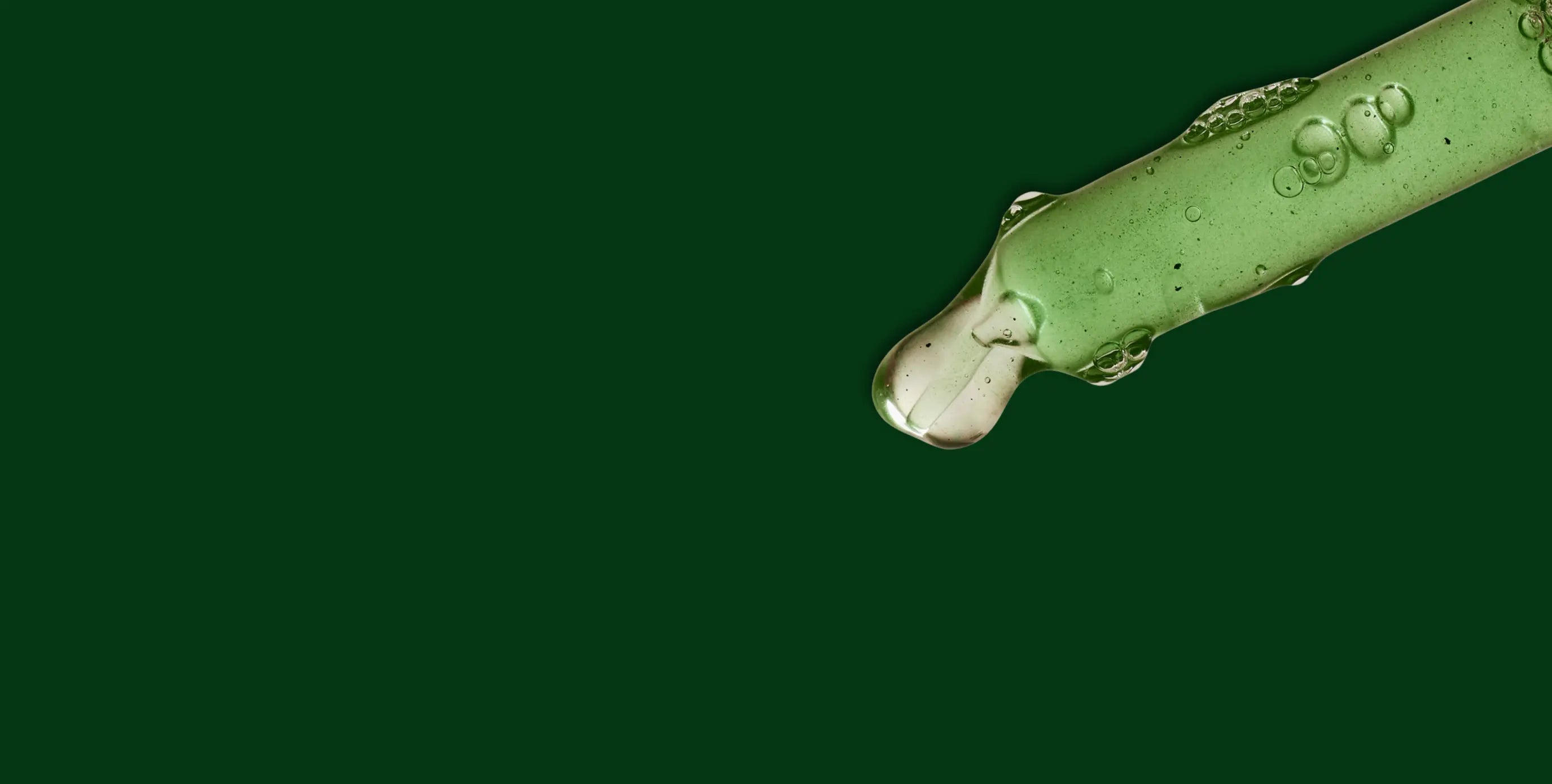 A girl holding a glass of greens pwoder